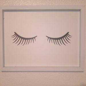 A white pic with eyelashes